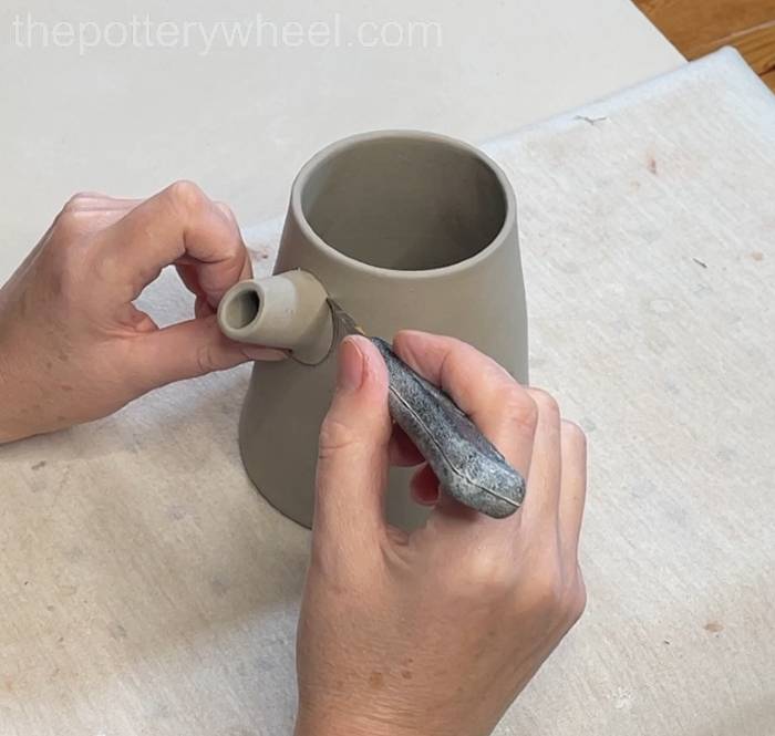 marking where to attach the spout to the pour over coffee dripper