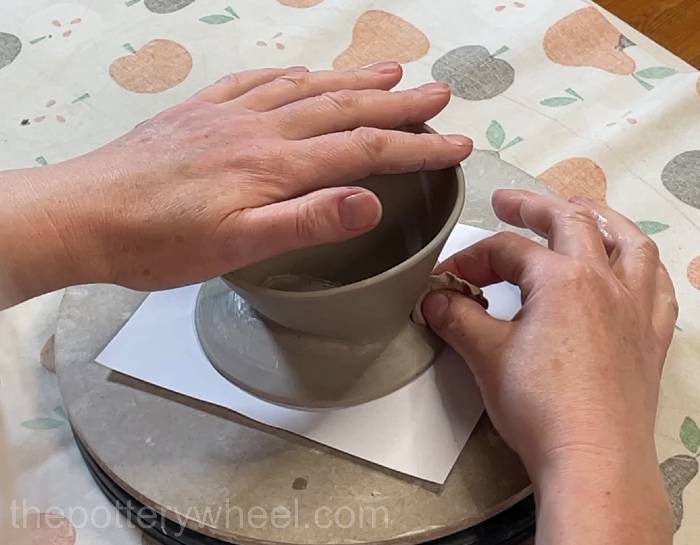 smoothing the clay