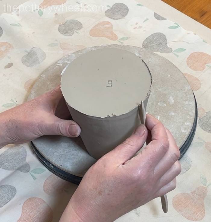 tidying up the bottom edge of the pour-over coffee dripper jug