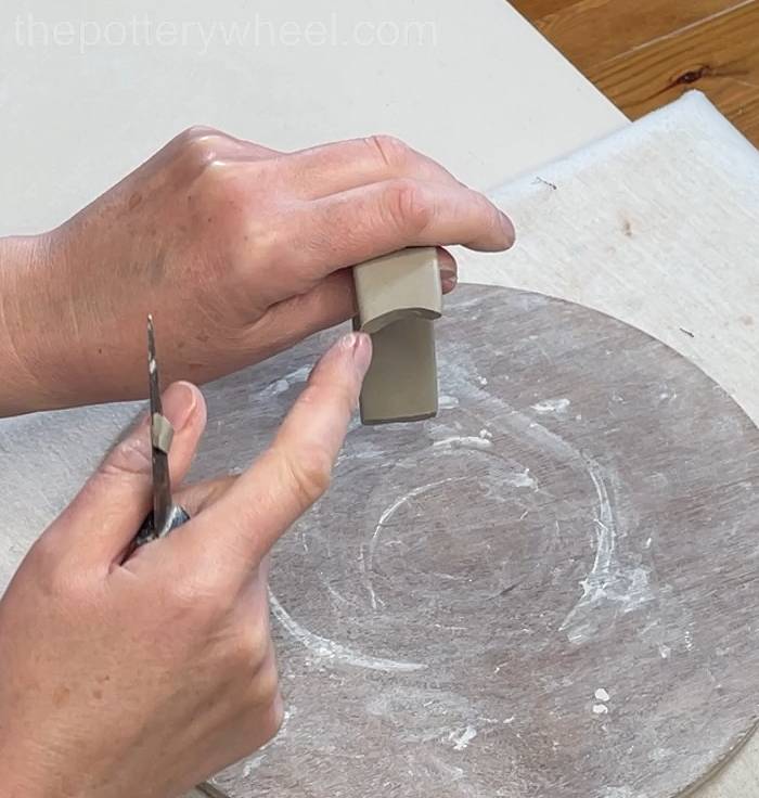 trimming the clay handle