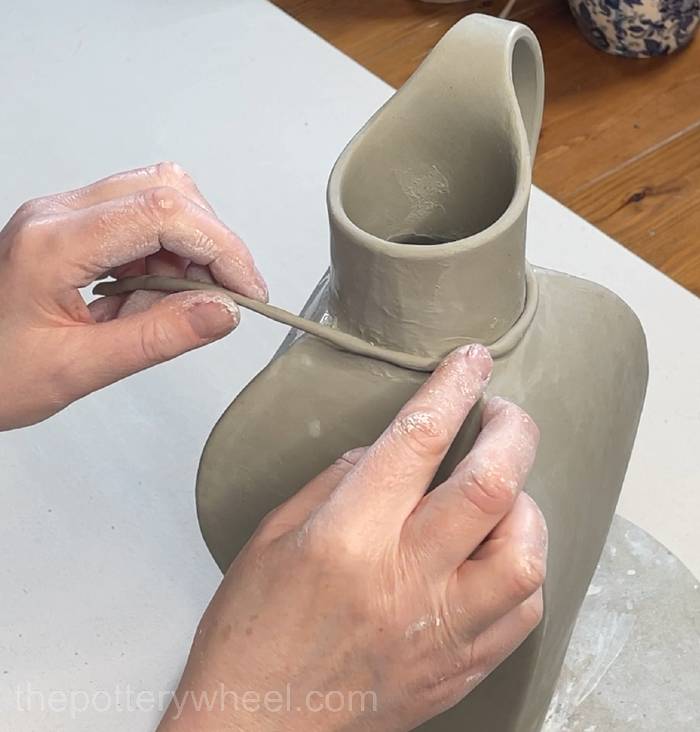 Adding a coil around the neck of the vase
