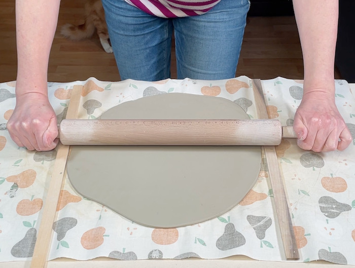 Rolling out a slab of clay