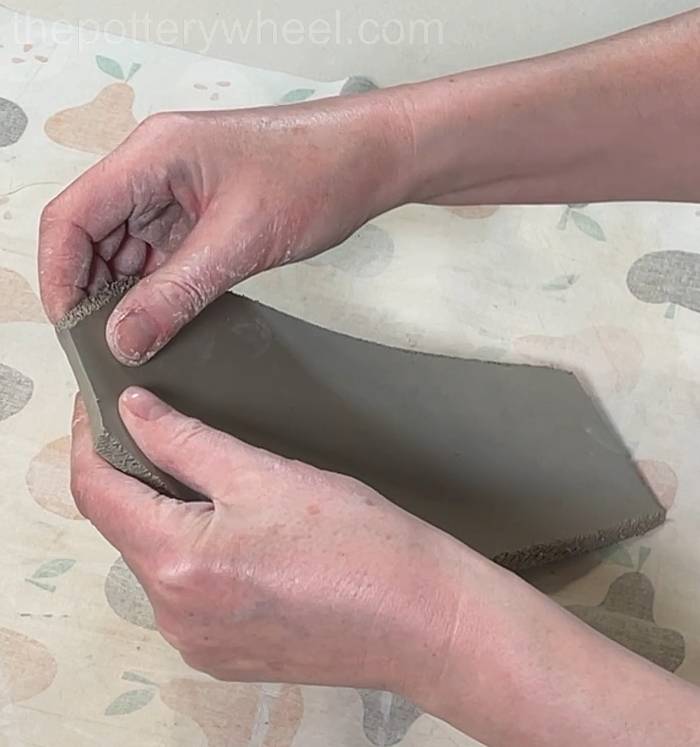 Shaping the side of the petal shaped vase