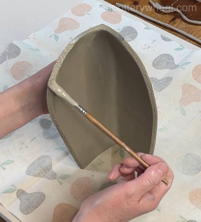 adding clay slip