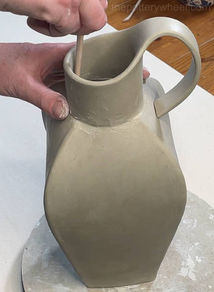 blending the neck on the inside of the vase