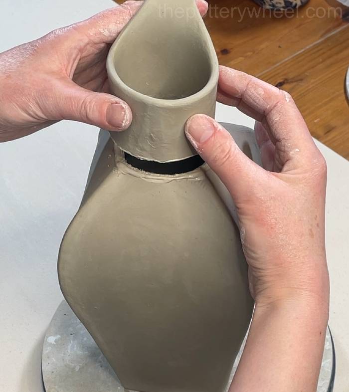 lowering the neck into place
