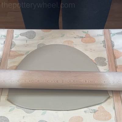Rolling a slab of clay
