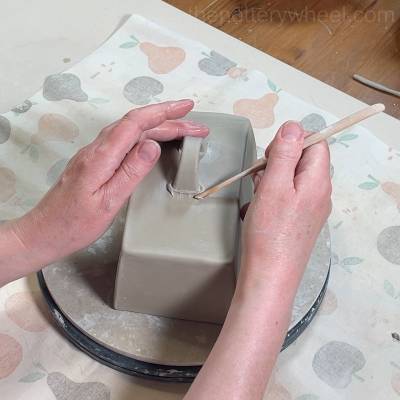 Adding the strip handle to the butter dish