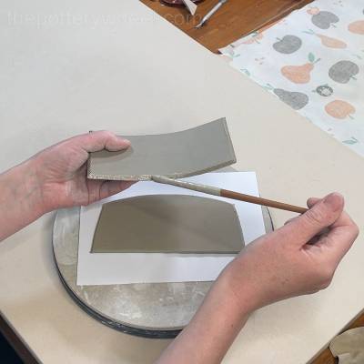 Applying slip to the roof of the butter dish lid