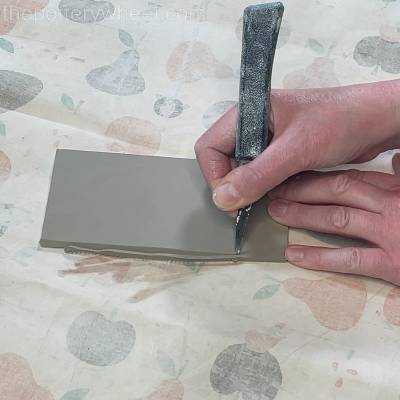 Bevelling the edge of the butter dish lid