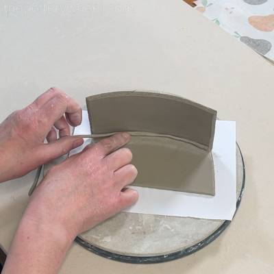 Pressing the clay coil into the join