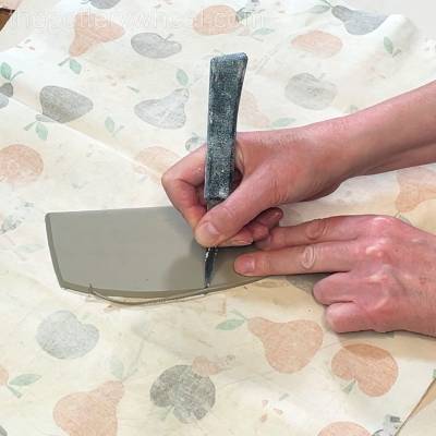 bevelling the edge of the butter dish