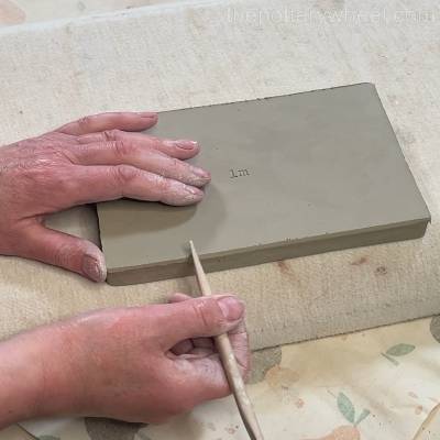 bevelling the under edge of the butter dish base