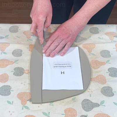 cutting out the base of the butter dish