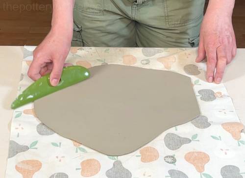 Ribbing the clay slab