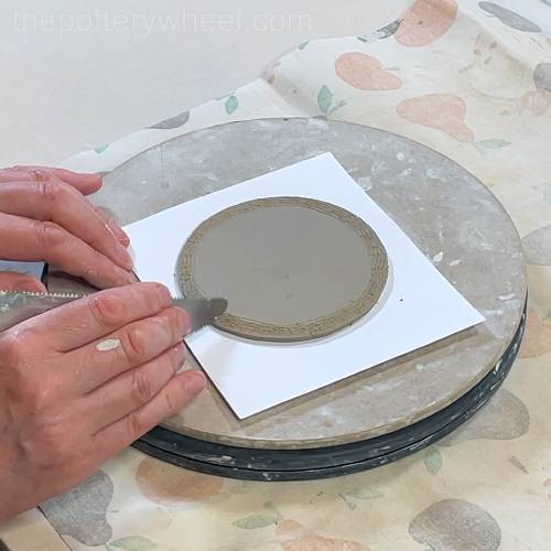 Scoring around the base of the lemon squeezer