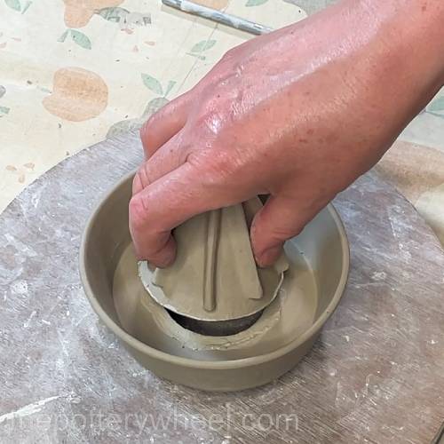 adding the cone to the lemon squeezer