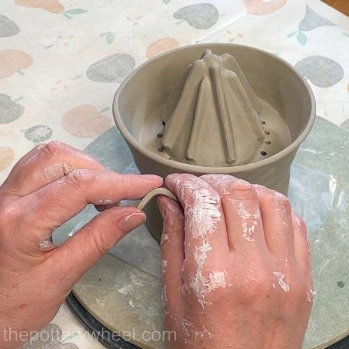 bending the side of the clay tab