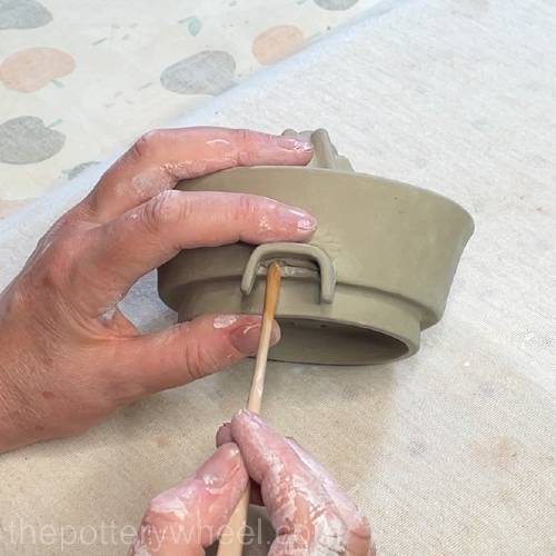 blending a coil on the underside of the tab