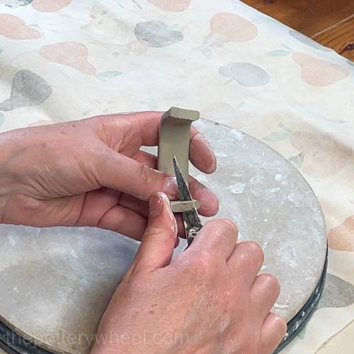 cutting the end of the handle to shape