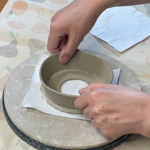 lower the side of the lemon squeezer into place