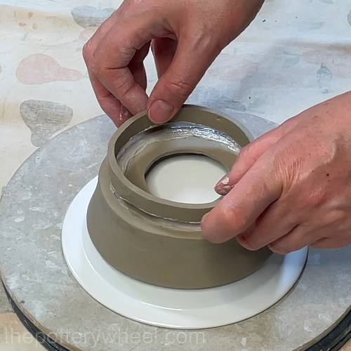 lowering the rim into place