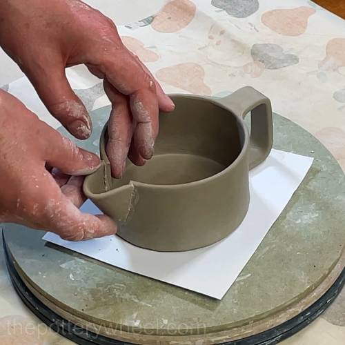 pressing the spout into position