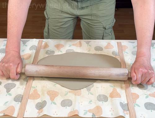 rolling a slab of clay