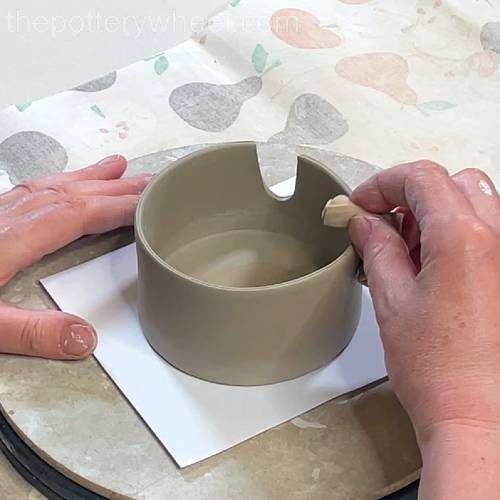 smoothing the rim of the lemon squeezer jug